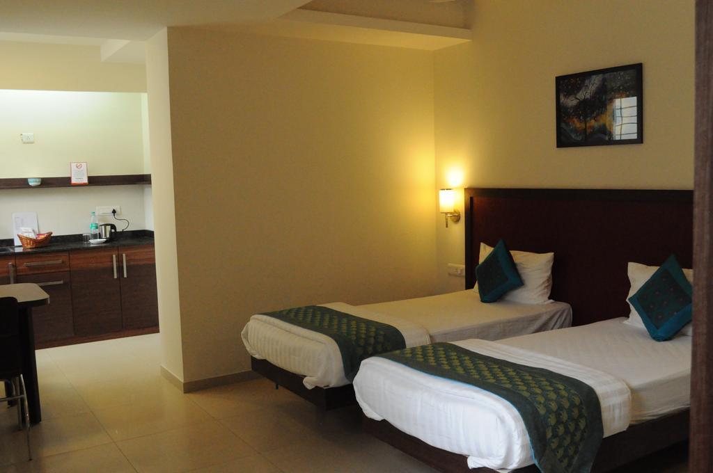 Ixora Suites Bangalore Rum bild